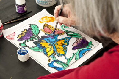 Painting butterflies on a pane of glass
