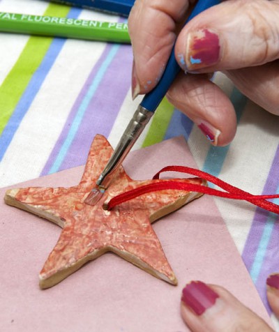 Star decoration being painted