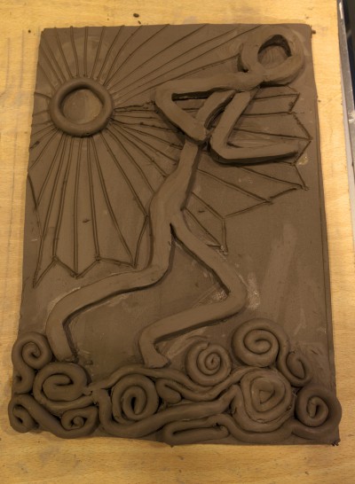 Clay tile of a person running outside