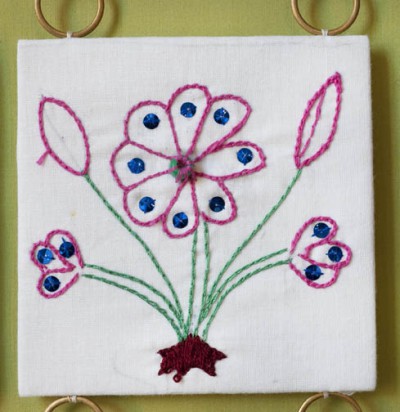 Embroidered purple flower
